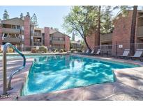 Enjoy the community pool surrounded by seating and lush trees for a relaxing and refreshing experience at 200 E Southern Ave # 117, Tempe, AZ 85282