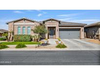 Charming single-story home with a well-manicured front yard and a neutral color palette, showcasing its curb appeal at 22744 E Stonecrest Dr, Queen Creek, AZ 85142