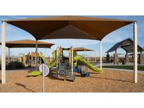 Community playground featuring play equipment, shade structures, and a welcoming environment for children and families at 32611 N Jasper St, San Tan Valley, AZ 85143