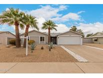 Charming single-story home featuring desert landscaping and a two-car garage at 4739 W Paradise Ln, Glendale, AZ 85306