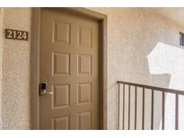 Condo unit door featuring a digital lock and the number 2124 displayed outside the unit at 6900 E Princess Dr # 2124, Phoenix, AZ 85054