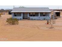 Charming block home with desert landscaping and covered porch at 7209 N Maple St, Maricopa, AZ 85139