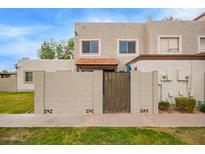 Charming townhouse exterior features a gated front entrance and low-maintenance landscaping at 1010 E Redfield Rd, Tempe, AZ 85283