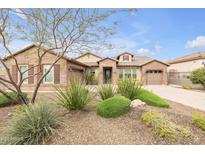 Beautiful single-story home with desert landscaping including shrubs and trees for low-maintenance appeal at 10886 N 137Th St, Scottsdale, AZ 85259