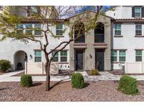 Contemporary townhome showcases a well-manicured gravel yard and charming front entrances with modern accents at 2323 E Huntington Dr, Phoenix, AZ 85040