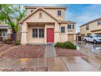 Charming two-story home featuring a red door, landscaped front yard, and well-maintained facade at 4129 W Park St, Phoenix, AZ 85041