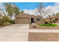 Charming single-story home with a well-maintained yard and a two-car garage at 4266 S Winter Ln, Gilbert, AZ 85297