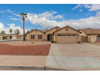 Charming single-story home featuring a well-manicured front yard and attached two-car garage at 4537 E Towne Ln, Gilbert, AZ 85234