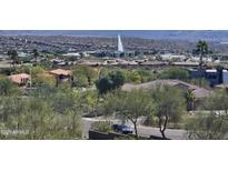 Scenic community view featuring lush landscaping and a water fountain, with a mountain backdrop at 13227 N Mimosa Dr # 107, Fountain Hills, AZ 85268