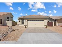 Charming single-story home with a well-maintained front yard and a two-car garage in a desirable neighborhood at 1418 E Megan St, Chandler, AZ 85225