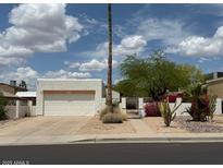 Charming single-story home with desert landscaping, a two-car garage, and beautiful desert landscaping at 1510 E Wescott Dr, Phoenix, AZ 85024