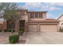 Two-story home featuring a two-car garage and well maintained landscape at 1805 E Sagebrush St, Gilbert, AZ 85296