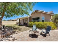 Secluded backyard features a fire pit and BBQ area, offering a peaceful space for outdoor living at 20630 N 42Nd Ave, Glendale, AZ 85308