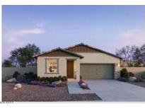 Charming single-story home featuring desert landscaping and a two-car garage at 25156 W Wayland Dr, Buckeye, AZ 85326