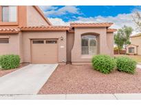 Charming single-story home with a well-maintained front yard and attached one car garage at 2600 E Springfield Pl # 10, Chandler, AZ 85286