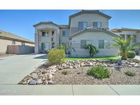 Two-story home showcasing manicured landscaping and an expansive driveway at 26915 N 54Th Ave, Phoenix, AZ 85083