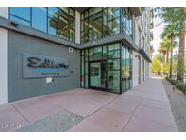 Modern building entrance with glass doors and windows, showcasing an upscale and inviting atmosphere at 3131 N Central Ave # 3001, Phoenix, AZ 85012