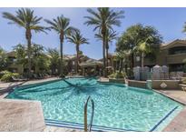 Community pool area with palm trees and meticulously maintained landscaping at 5335 E Shea Blvd # 2047, Scottsdale, AZ 85254