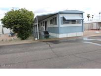 Charming single-story home with covered porch and blue and white trim at 7807 E Main St # D-6, Mesa, AZ 85207