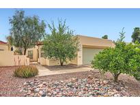 Charming home featuring desert landscaping with rocks and various desert plants at 2167 E Aspen Dr, Tempe, AZ 85282