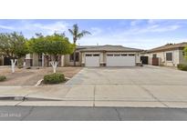 Charming single-story home features a spacious driveway and a convenient two-car garage at 4665 E Dartmouth St, Mesa, AZ 85205