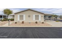 Cozy single-story home with desert landscaping, charming details, and covered parking space at 890 E Tee St, San Tan Valley, AZ 85140