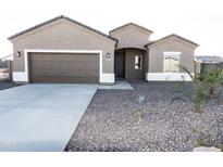 Charming single-story home with desert landscaping and a two-car garage at 10005 W Mission Dr, Arizona City, AZ 85123