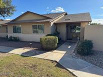 Charming single-story home featuring well-maintained landscaping and a welcoming entrance at 13214 W Aleppo Dr, Sun City West, AZ 85375
