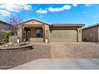 Charming single-story home with a two-car garage and landscaped front yard at 12114 W Desert Moon Way, Peoria, AZ 85383