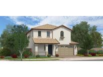 Charming two-story home with a tile roof, covered porch, and a well-manicured landscaped yard at 23781 N 162Nd Ave, Surprise, AZ 85387
