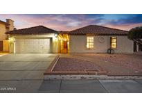 Charming single-story home featuring a tile roof, stucco exterior, and well-maintained landscaping at 5431 W Cochise Dr, Glendale, AZ 85302