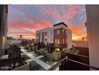 Stunning townhome exterior showcasing modern architecture and a vibrant sunset backdrop at 820 N 8Th Ave # 22, Phoenix, AZ 85007