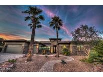 Stunning single story home with desert landscaping and a three car garage at 19644 N Majestic Vista Ct, Surprise, AZ 85387
