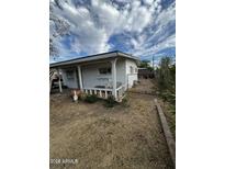 Charming single story home with a cozy front porch perfect for relaxing outdoors at 3241 W Fillmore St, Phoenix, AZ 85009