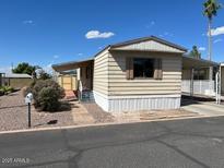 Charming single-story manufactured home with well-maintained landscaping at 345 S 58Th St # 31, Mesa, AZ 85206