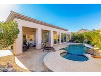 Outdoor patio and kidney-shaped pool with stone surround and mountain views at 14808 E Miramonte Way, Fountain Hills, AZ 85268