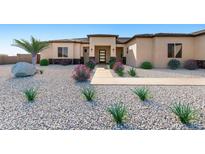 Stunning single-story home with xeriscaping, desert landscaping, and covered entryway at 33401 N 142Nd Way, Scottsdale, AZ 85262