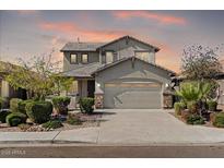 Inviting two-story home showcasing desert landscaping and a neutral color palette at 38 S 197Th Ln, Buckeye, AZ 85326