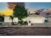 Charming single-story home featuring well-maintained landscaping and an attached two-car garage at 6814 N 11Th St, Phoenix, AZ 85014