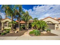 Attractive single-story home with desert landscaping and a private courtyard entrance at 16446 N 59Th St, Scottsdale, AZ 85254