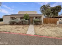 Charming single-story home with a quaint entrance and mature landscaping at 2155 W Farmdale Ave # 24, Mesa, AZ 85202