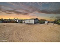 Charming single-story home with neutral paint, desert landscaping, and a gated entrance at 404 W Galvin St, Phoenix, AZ 85086