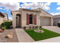 Charming single-story home with a well-manicured lawn and inviting front entry, showcasing the home's curb appeal at 5747 S Del Rancho --, Mesa, AZ 85212