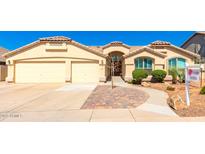 Inviting, single-story home with a two-car garage and desert landscaping under a clear blue sky at 9728 E Pantera Ave, Mesa, AZ 85212