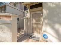 Inviting front entryway with security gate, screen door, and a 'Welcome' doormat at 1717 E Union Hills Dr # 1076, Phoenix, AZ 85024