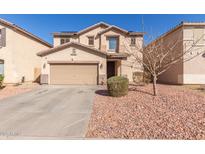 Charming home featuring a two-car garage, neutral stucco facade, and low-maintenance landscaping at 45608 W Barbara Ln, Maricopa, AZ 85139