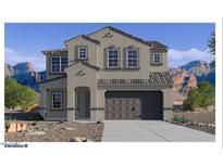 Charming two-story home featuring a neutral gray facade and a two-car garage, set against a picturesque mountain backdrop at 7417 W Buckhorn Trl, Peoria, AZ 85383
