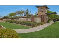The Dorada Estates community entrance features well-maintained landscaping, shrubbery, and a brick gate structure at 17756 E Colt Dr, Queen Creek, AZ 85142