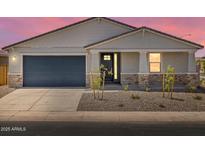 Charming single-story home with stone accents, desert landscaping, and a two-car garage at 345 S Alegria Ln, Casa Grande, AZ 85194