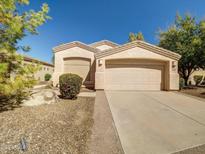 Charming single-story home featuring a two-car garage and desert landscaping at 3918 E Carson Rd, Phoenix, AZ 85042
